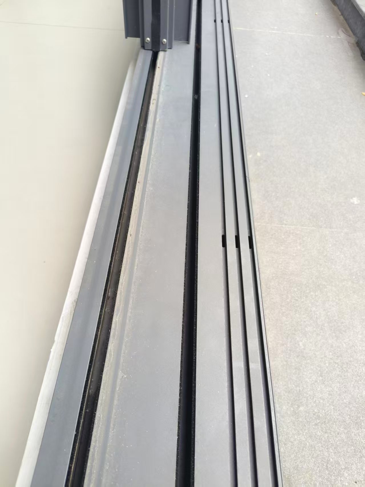 A modern aluminum panoramic sliding door track system