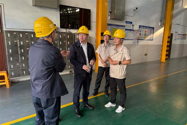 Factory audit inspection in China showing engineer reviewing production line quality control